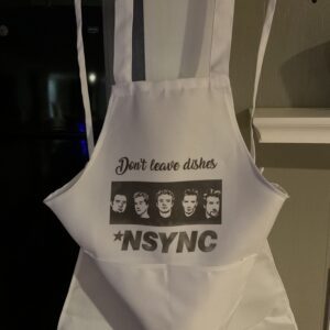 A white apron with some faces on it