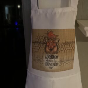 A white apron with an image of a chicken on it.