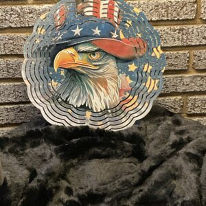 A bald eagle wearing an american flag hat.