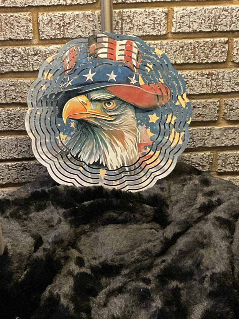 A bald eagle wearing an american flag hat.