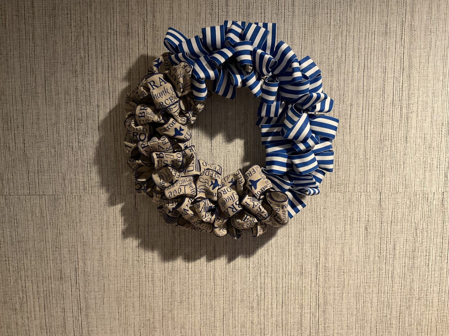 A wreath made of fabric and paper.
