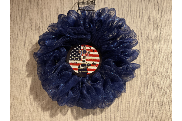 A wreath with the american flag on it.