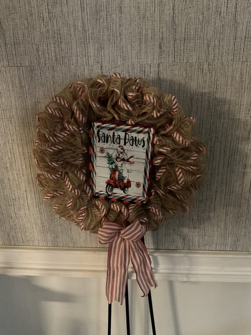 A wreath with a picture of santa clause on it.