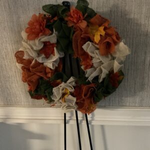 A wreath hanging on the wall of a room.