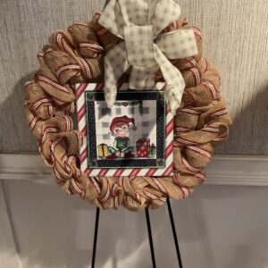 A wreath with a picture of a person on it.