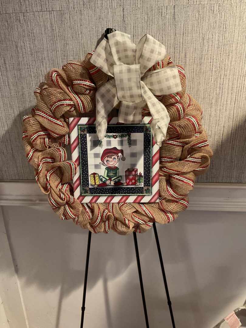 A wreath with a picture of a person on it.