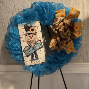 A wreath with a picture of a man on it.