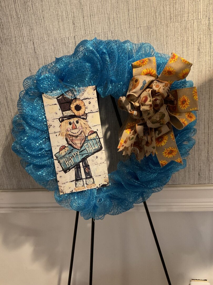 A wreath with a picture of a man on it.