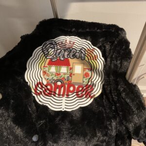 A black jacket with the words queen camper on it.