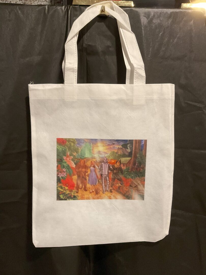 A white bag with a painting of people