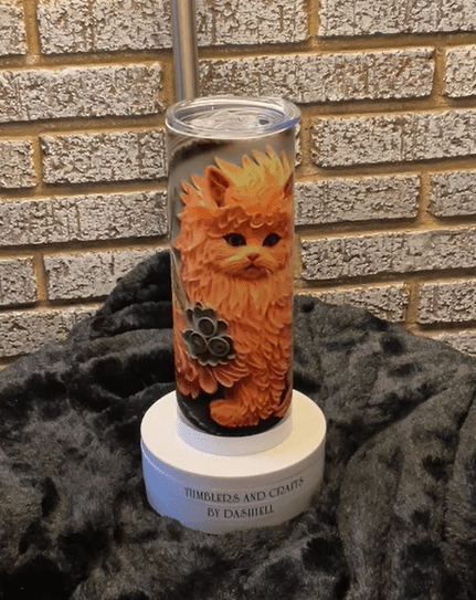 A candle with an image of a cat on it.