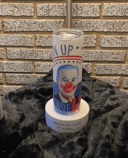 A candle with an image of clown on it.