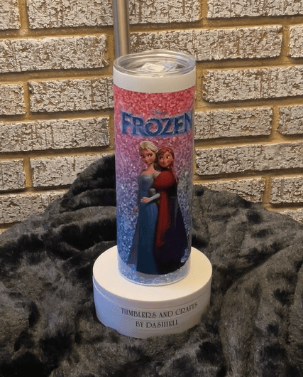 A candle with the words frozen on it.