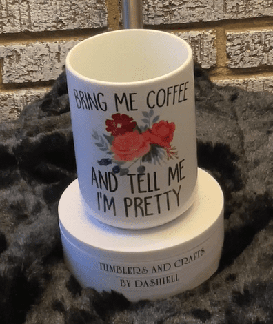A coffee mug sitting on top of a cup.