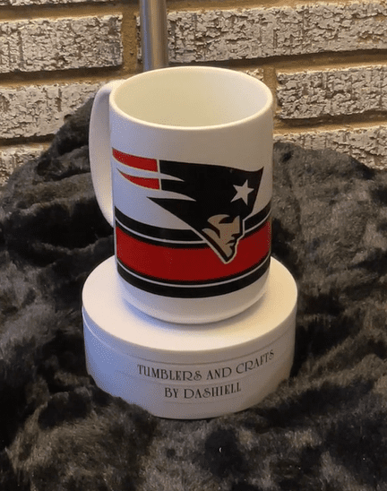 A coffee mug with the new england patriots logo on it.