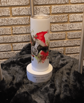 A candle with pictures of cats on it