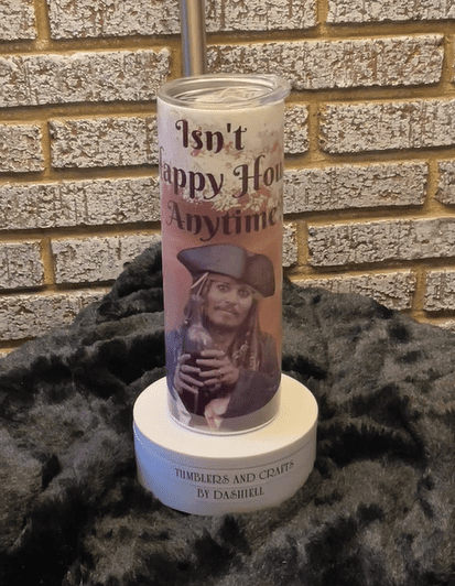 A candle that has a picture of a woman on it.