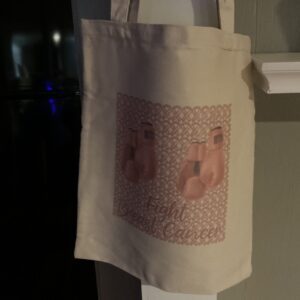 A bag hanging on the wall with pink socks