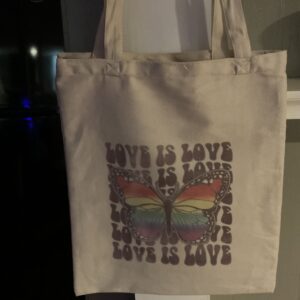 A bag that has been printed with the words " love is love ".