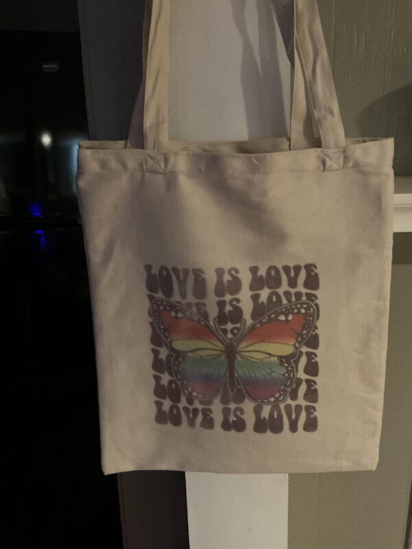 A bag that has been printed with the words " love is love ".