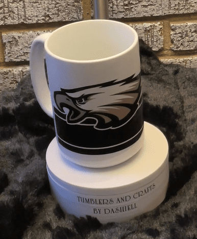 A coffee mug with an eagle on it.
